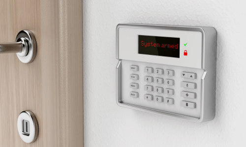 activated burglar alarm keypad next to door entrance
