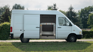 2M Technology 2MX-6550M mobile baggage and parcel x-ray scanner mounted inside van with outdoor background