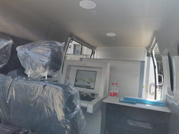 interior of vehicle mounted with 2M Technology 2MX-6550M mobile baggage and parcel x-ray scanner