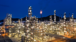 Aerial view of a petrochemical plant lit up with explosion-proof lights