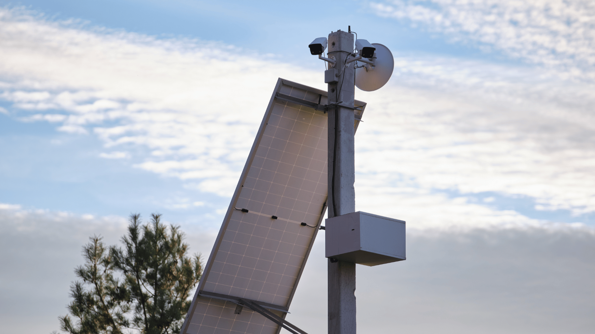Pole mounted surveillance cameras and loudspeakers with solar panels