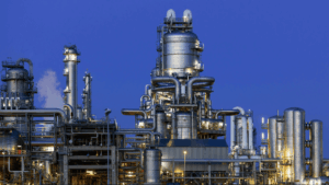 Landscape view of an industrial oil refinery at nighttime