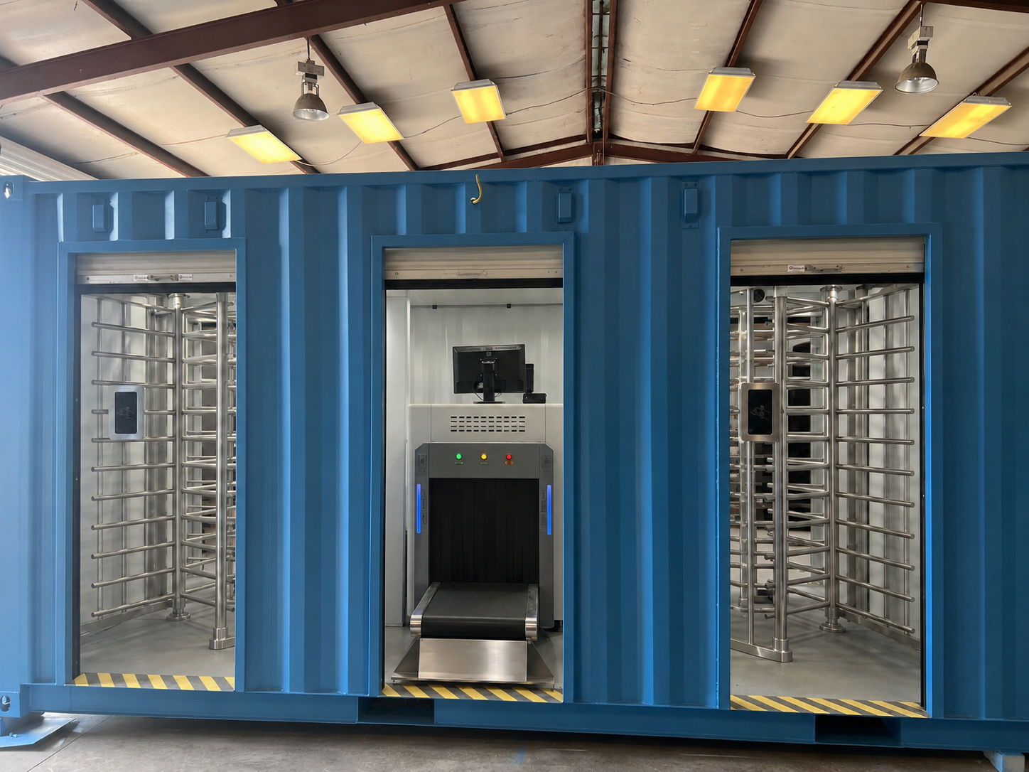 Container security checkpoint front view — X-ray conveyor center bay with full-height turnstile lanes on each side