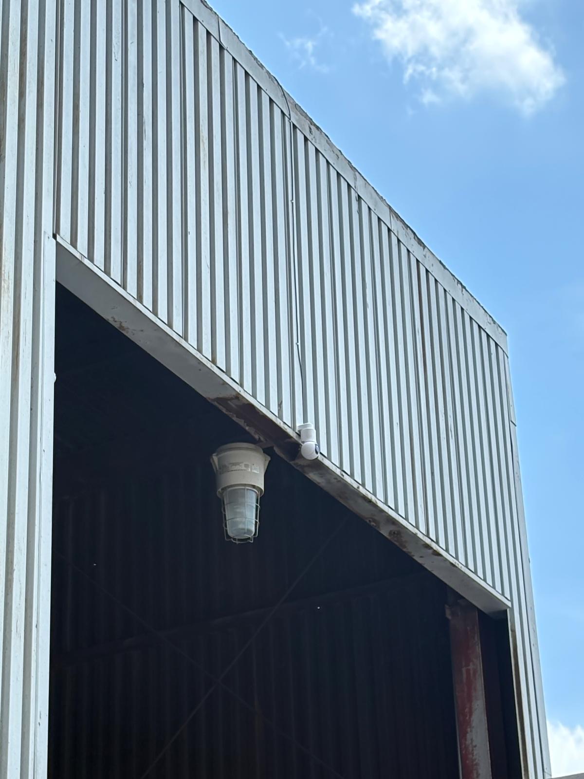 Ubiquiti UniFi G6 PTZ camera installed above entrance of grain silo
