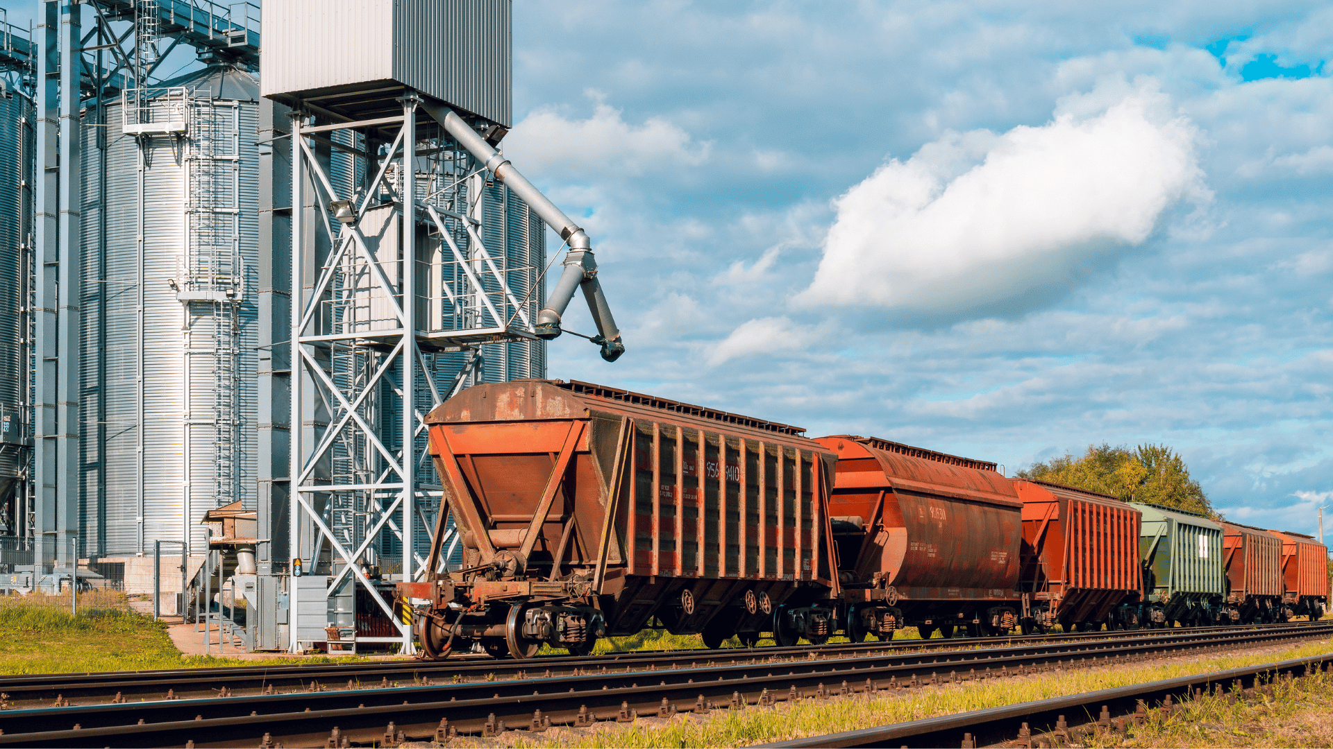 Grain loading trains stationed at grain silo