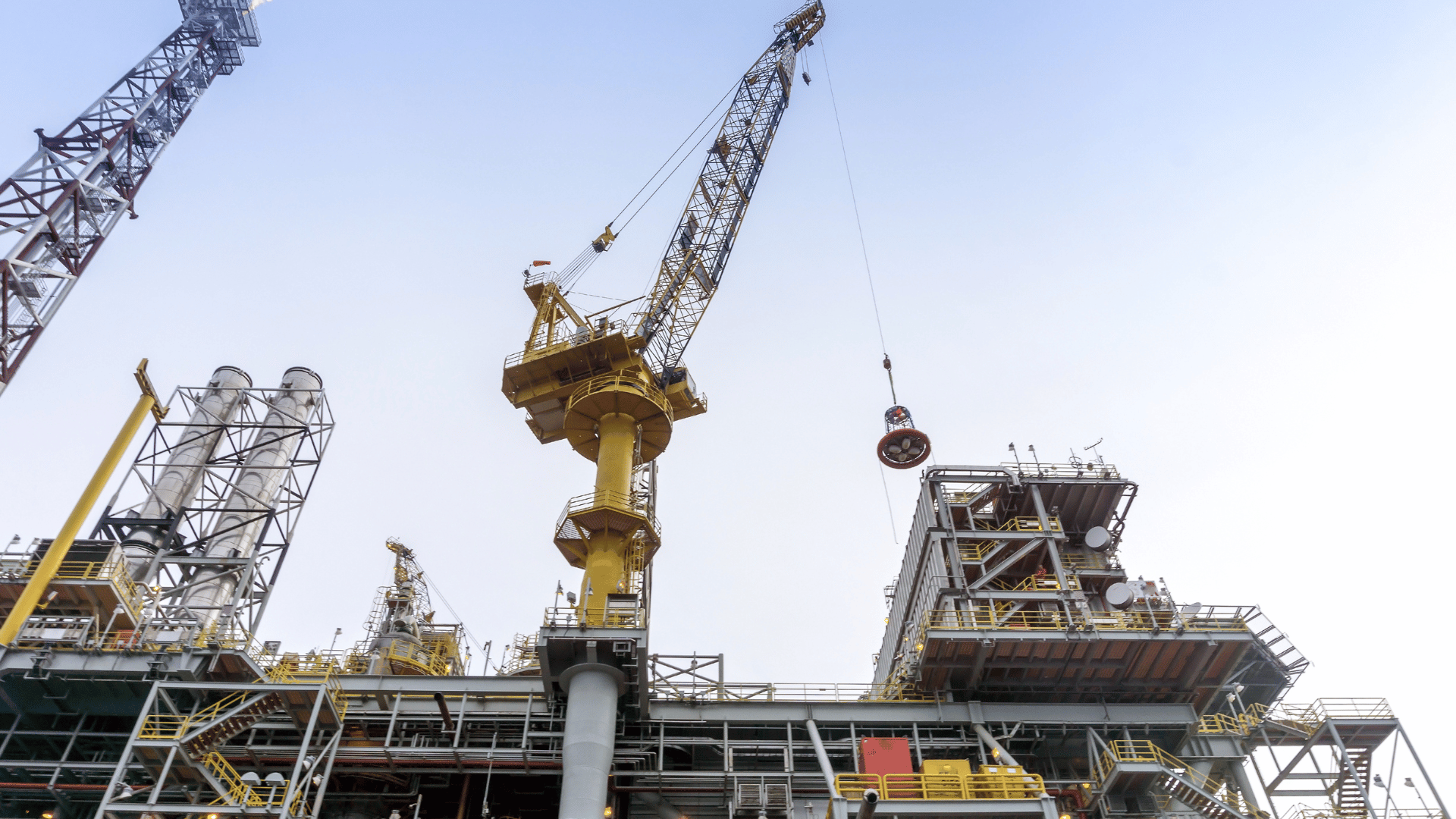 Cranes at offshore oil production platform