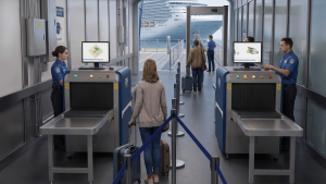 cruise ship x-ray scanners at passenger boarding security checkpoint inside gangway terminal