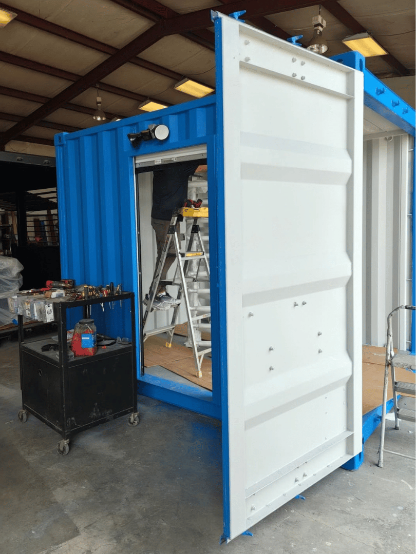 Installation of a full-height turnstile inside a custom 10-foot shipping container security checkpoint