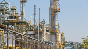 Surveillance camera monitoring perimeter outside oil refinery plant
