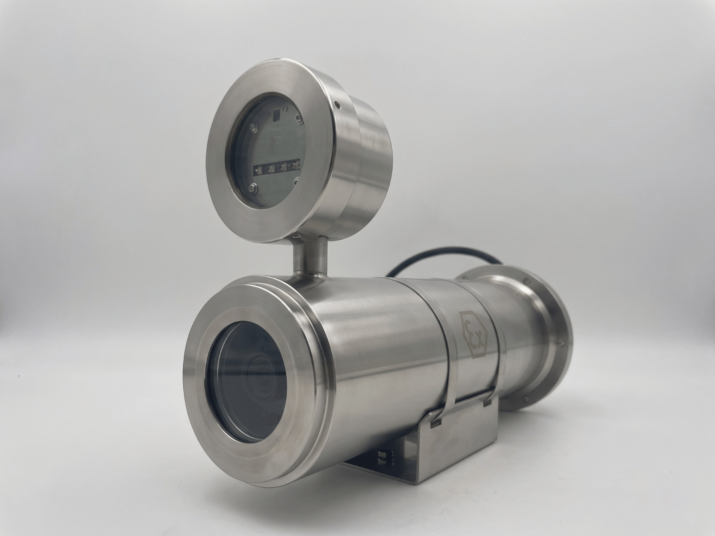 Three-quarter angle view of stainless steel custom explosion-proof Verkada bullet camera housing 2MEXH-2666 with top IR illuminator module and mounting bracket